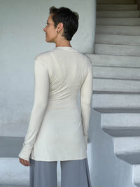 caraucci v-neck long sleeve cream tunic with thumbholes #color_cream