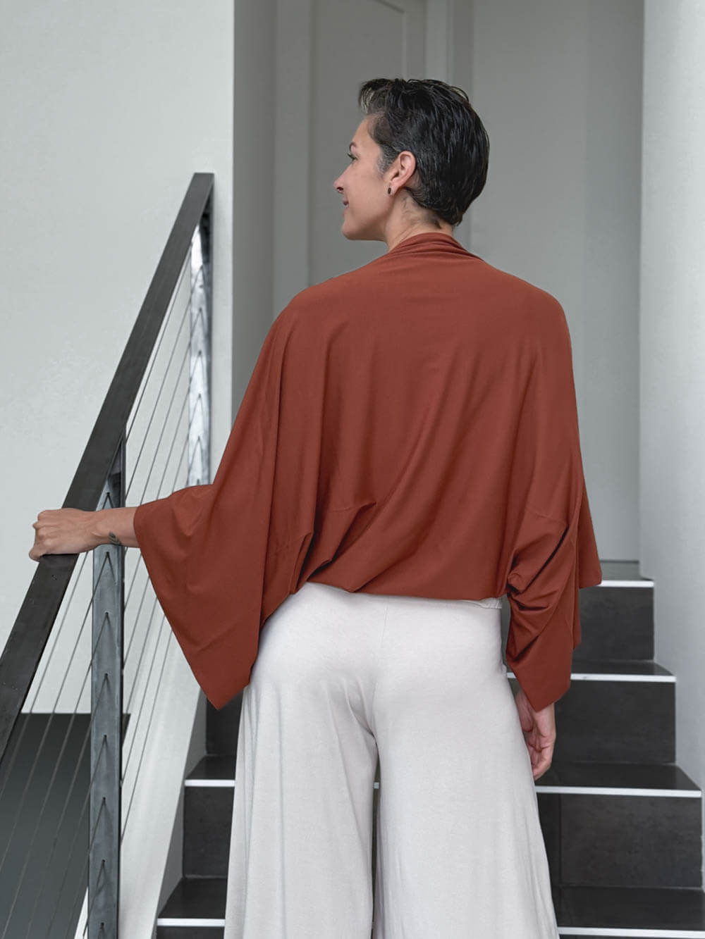 caraucci convertible orange draped shrug that converts into a cowl neck backless tunic #color_copper