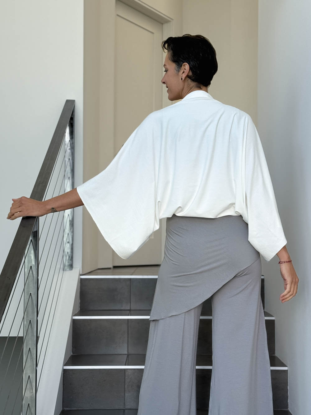 caraucci convertible white draped shrug that converts into a cowl neck backless tunic #color_off-white