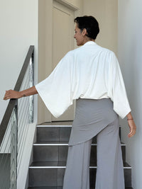 caraucci convertible white draped shrug that converts into a cowl neck backless tunic #color_off-white