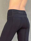 women's bamboo spandex pants with raised stitch details and 2 zipper pockets #color_black