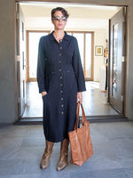 caraucci bamboo spandex black coat dress with 6 pockets and brass buttons up the front, can be worn as a jacket or dress #color_black