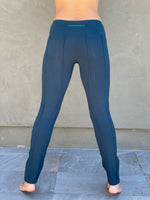 women's teal bamboo spandex pants with raised stitch details and 2 zipper pockets #color_teal