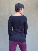 women's plant based rayon jersey long sleeve black top with slight cowl neck and side ruching #color_black