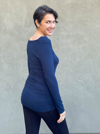 women's plant based rayon jersey long sleeve navy blue top with slight cowl neck and side ruching #color_navy