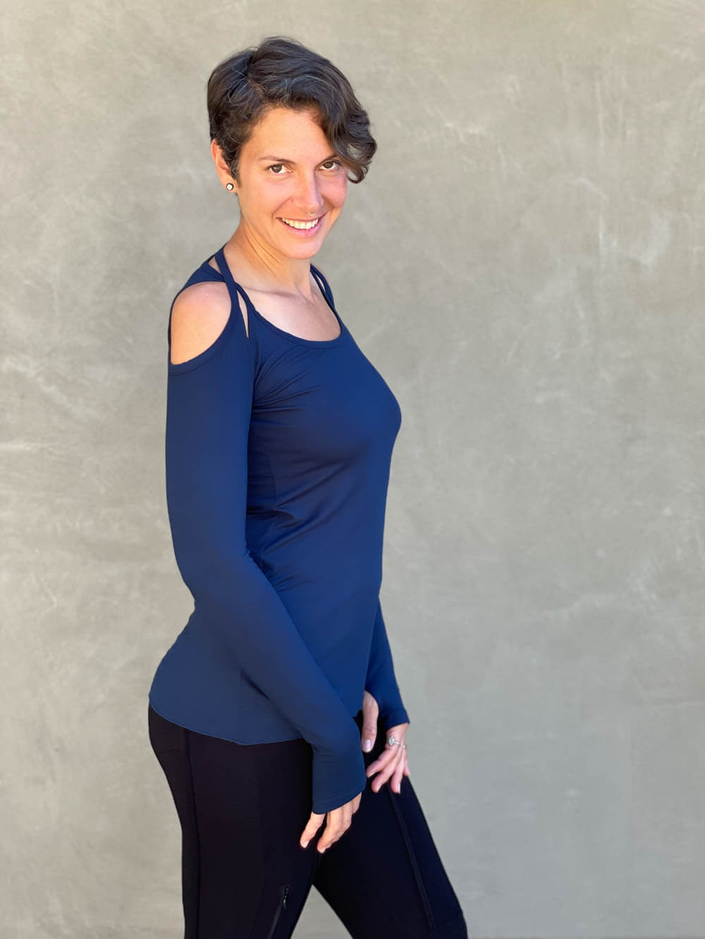 women's plant based stretchy rayon jersey long sleeve peekaboo shoulder navy blue top with thumbholes #color_navy