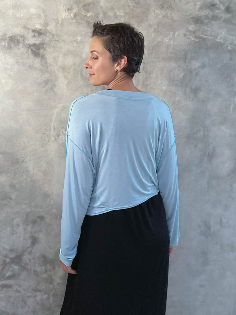 caraucci lightweight plant-based-rayon jersey sky blue reversible long sleeve knot front shrug top #color_canal-blue