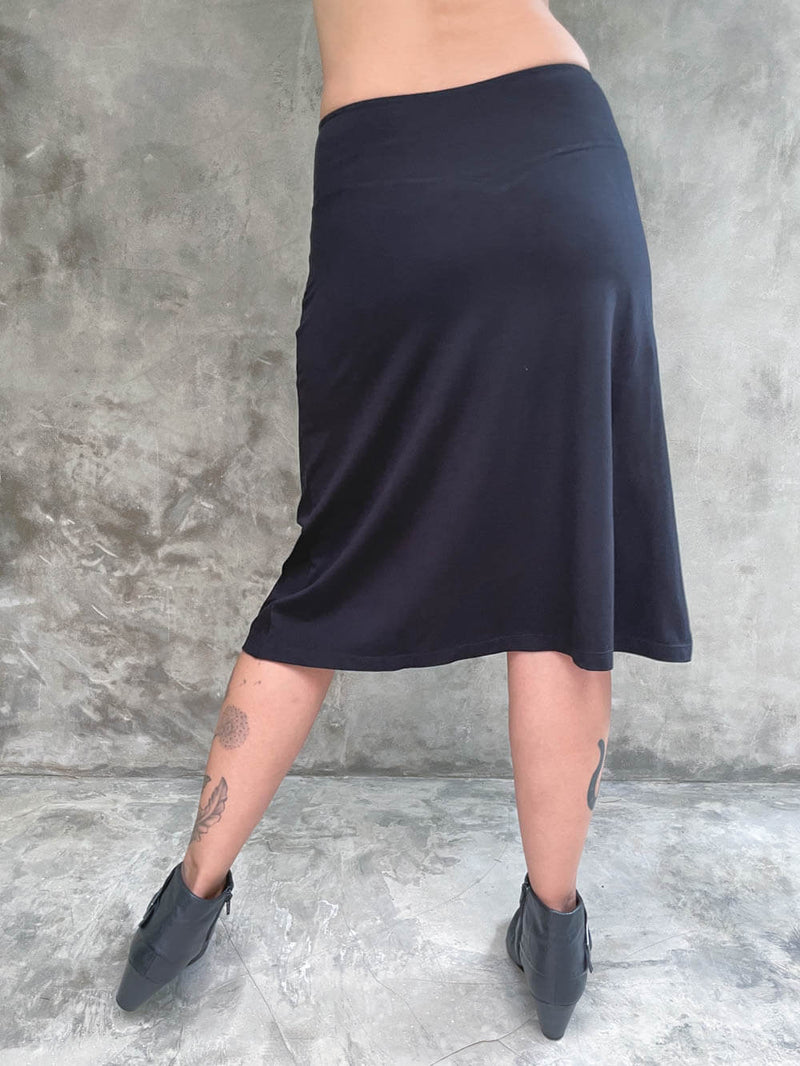 caraucci stretchy plant-based black a line midi skirt #color_black