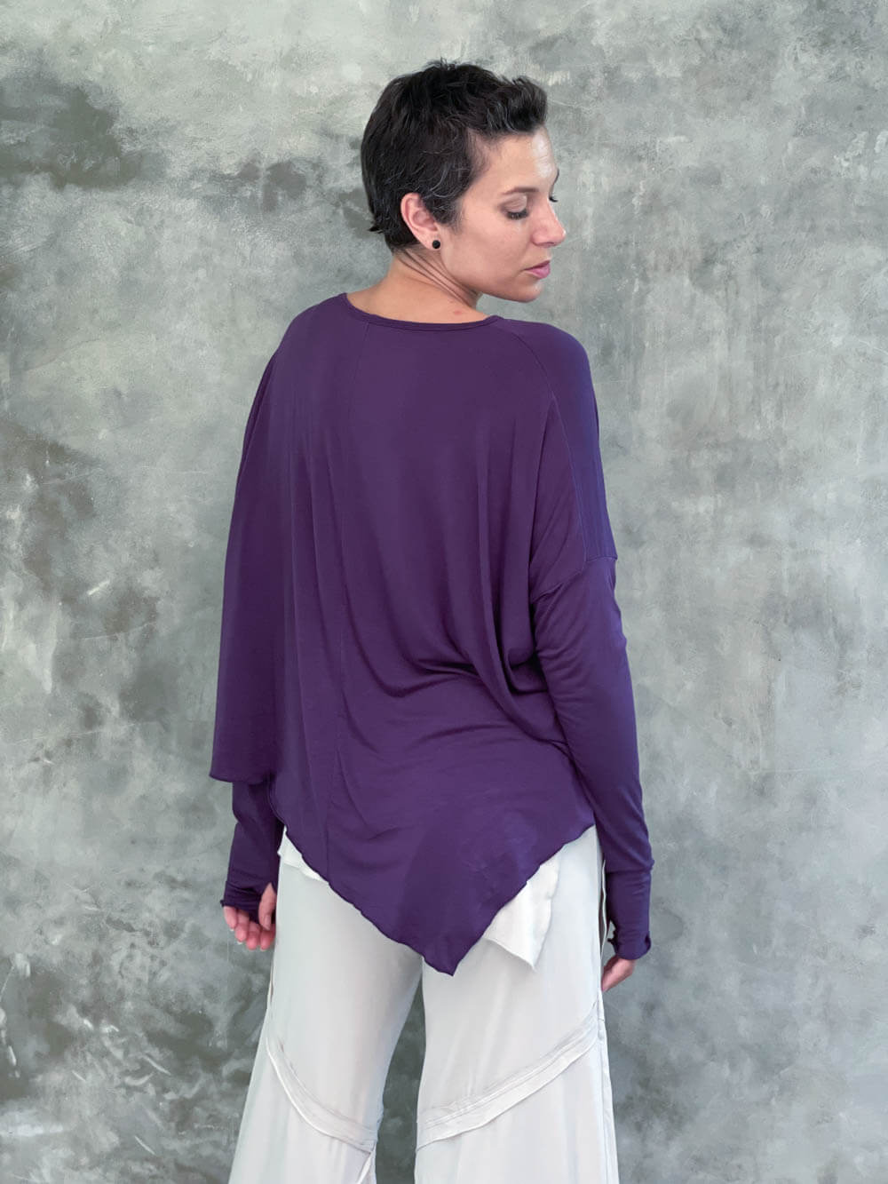 caraucci plant-based rayon jersey purple asymmetrical hem oversized long sleeve top with thumbholes #color_plum