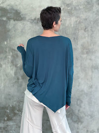 caraucci plant-based rayon jersey teal blue asymmetrical hem oversized long sleeve top with thumbholes #color_teal