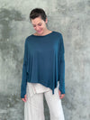caraucci plant-based rayon jersey teal blue asymmetrical hem oversized long sleeve top with thumbholes #color_teal