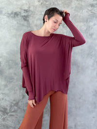 caraucci plant-based rayon jersey maroon asymmetrical hem oversized long sleeve top with thumbholes #color_wine