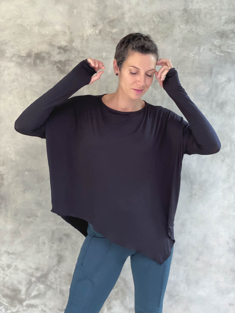 caraucci plant-based rayon jersey black asymmetrical hem oversized long sleeve top with thumbholes #color_black