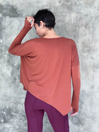 caraucci plant-based rayon jersey rust asymmetrical hem oversized long sleeve top with thumbholes #color_copper