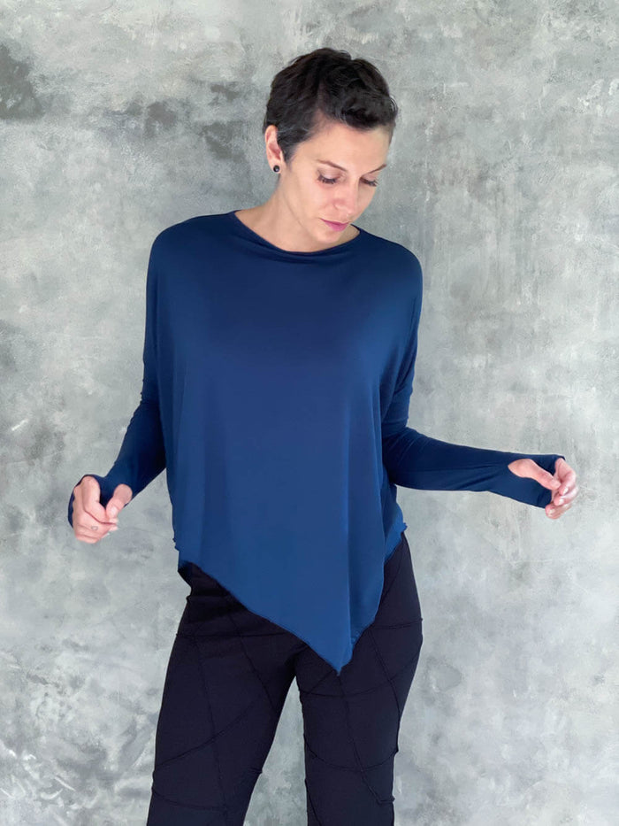 caraucci plant-based rayon jersey navy blue asymmetrical hem oversized long sleeve top with thumbholes #color_navy