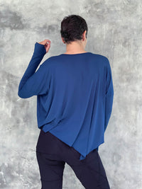 caraucci plant-based rayon jersey navy blue asymmetrical hem oversized long sleeve top with thumbholes #color_navy