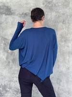 caraucci plant-based rayon jersey navy blue asymmetrical hem oversized long sleeve top with thumbholes #color_navy