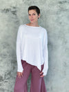 caraucci plant-based rayon jersey white asymmetrical hem oversized long sleeve top with thumbholes #color_white