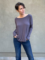 women's plant-based steel grey relaxed fit jersey long sleeve top shown as a shrug #color_steel