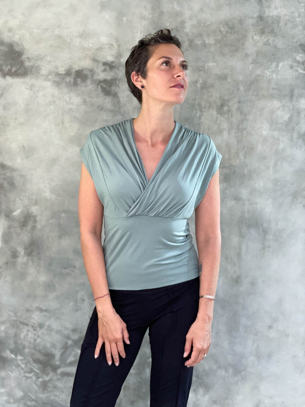 caraucci plant-based rayon stretch jersey sage green cross over neckline top #color_moss