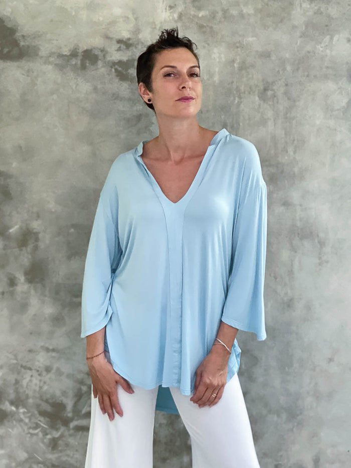 caraucci women's lightweight plant-based rayon jersey v-neck loose fit 3/4 sleeve sky blue kurta tunic #color_canal-bluewomen's lightweight jersey sky blue 3/4 sleeve v-neck kurta tunic #color_canal-blue