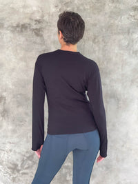 caraucci plant-based rayon stretch jersey black long sleeve cross over neckline top #color_black