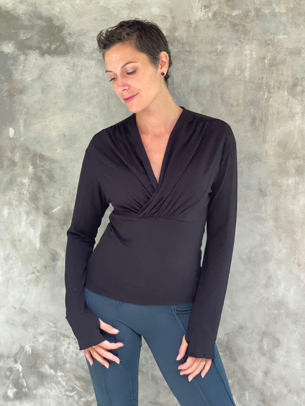 caraucci plant-based rayon stretch jersey black long sleeve cross over neckline top #color_black