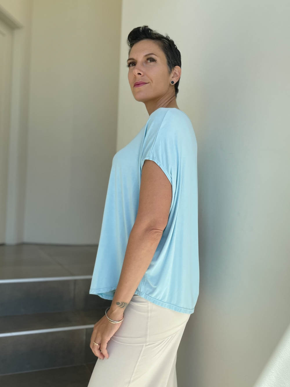 caraucci plant-based rayon jersey lightweight sky blue unstructured cap sleeve tee #color_canal-blue