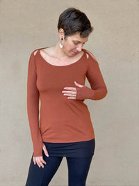 women's plant based stretchy rayon jersey long sleeve peekaboo shoulder burnt orange top with thumbholes #color_copper