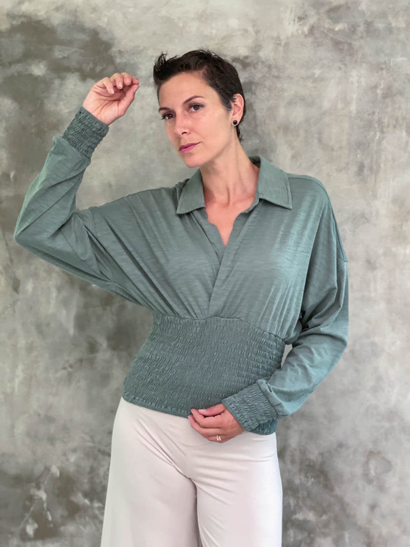 caraucci women's cotton slub sage green cotton slub v neck long sleeve dolman sleeve collared top with smocked waistband and cuffs #color_matcha
